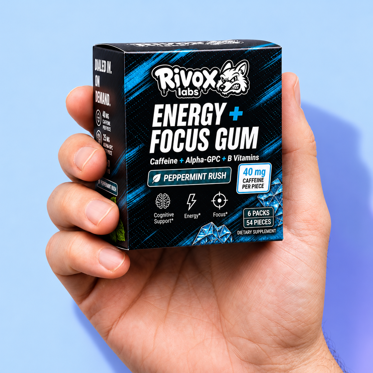An adult hand holding a pocket-size Rivox Peppermint Rush Energy and Focus Gum box